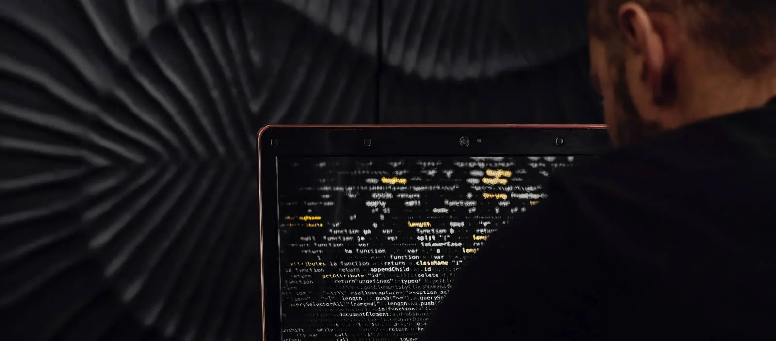 Cybersecurity expert reviewing computer code