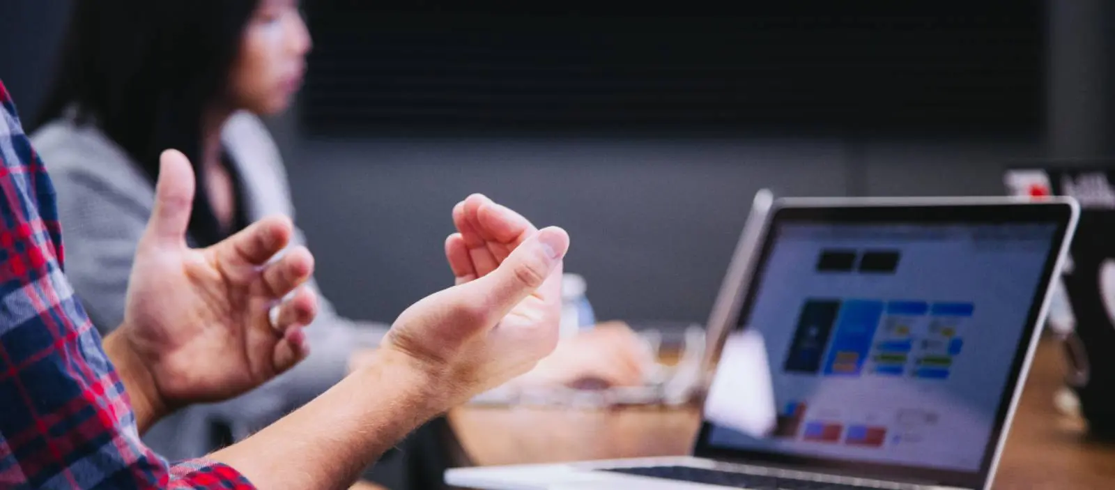 cybersecurity experts discussing benefits of managed service with customer