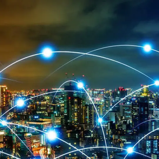 city skyline at night with graphic overlay