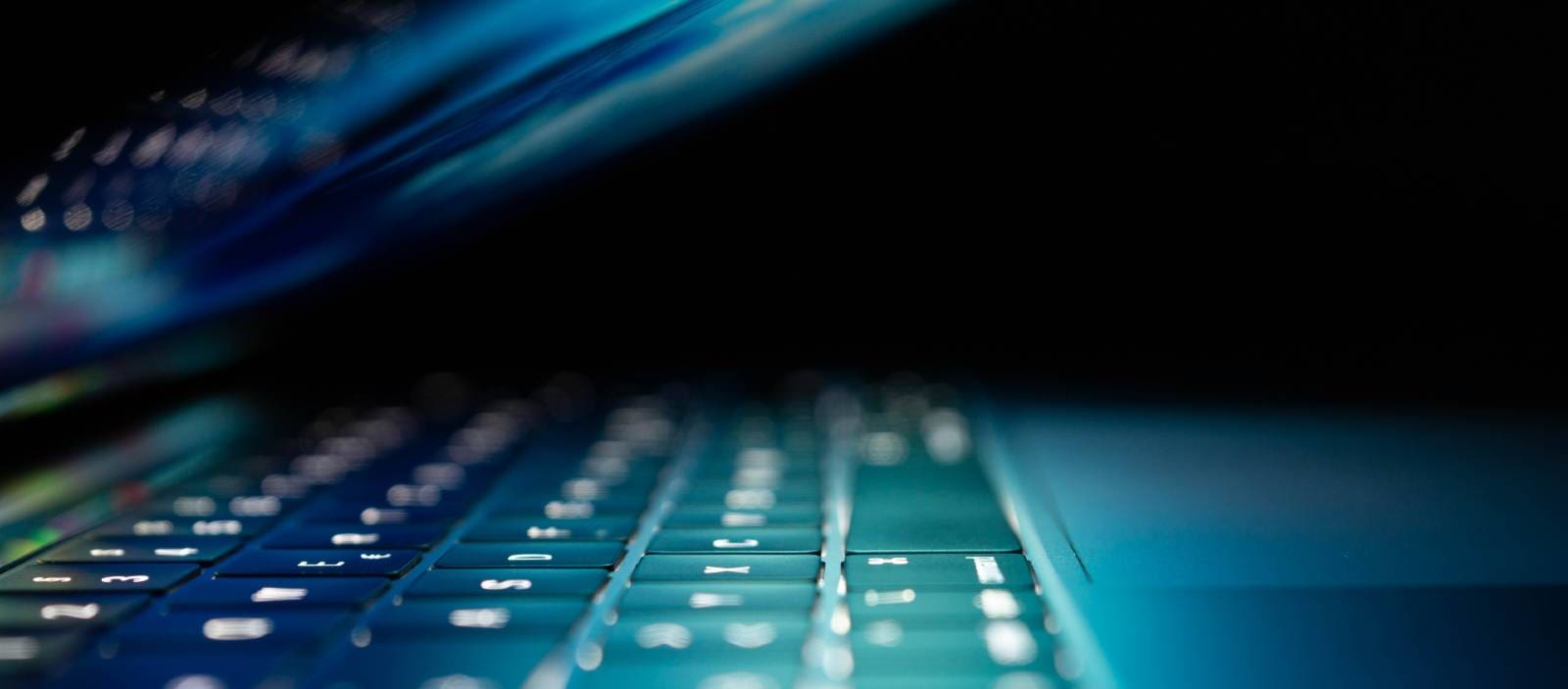 Cybersecurity expert reviewing computer device