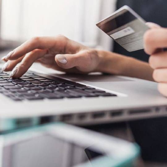 SOmeone paying for an online shopping purchase