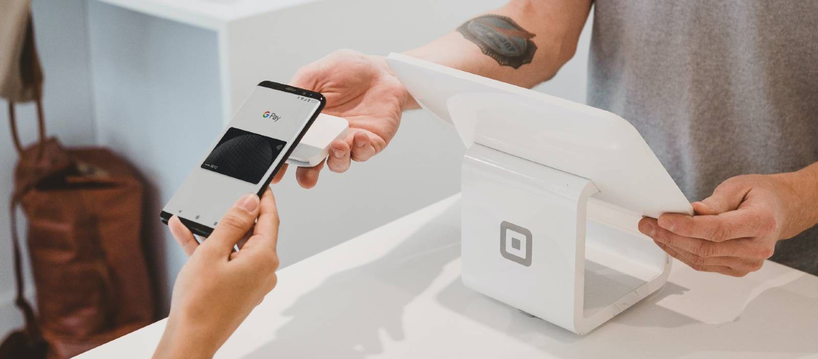 person taking payment by card