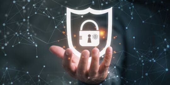 Decoding MDR vs MSSP 1 a hand holding a graphic padlock