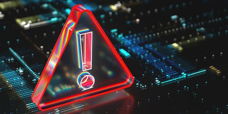 Warning triangle over a circuit board